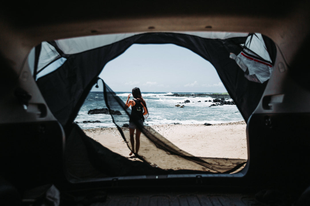 Person standing next to the ocean