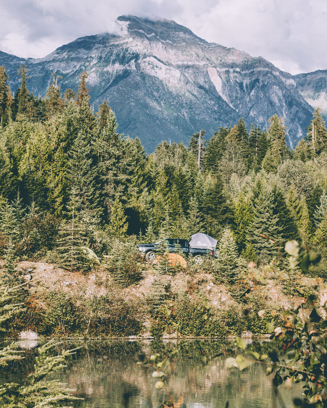 Truck tent overlanding in the forest and mountains