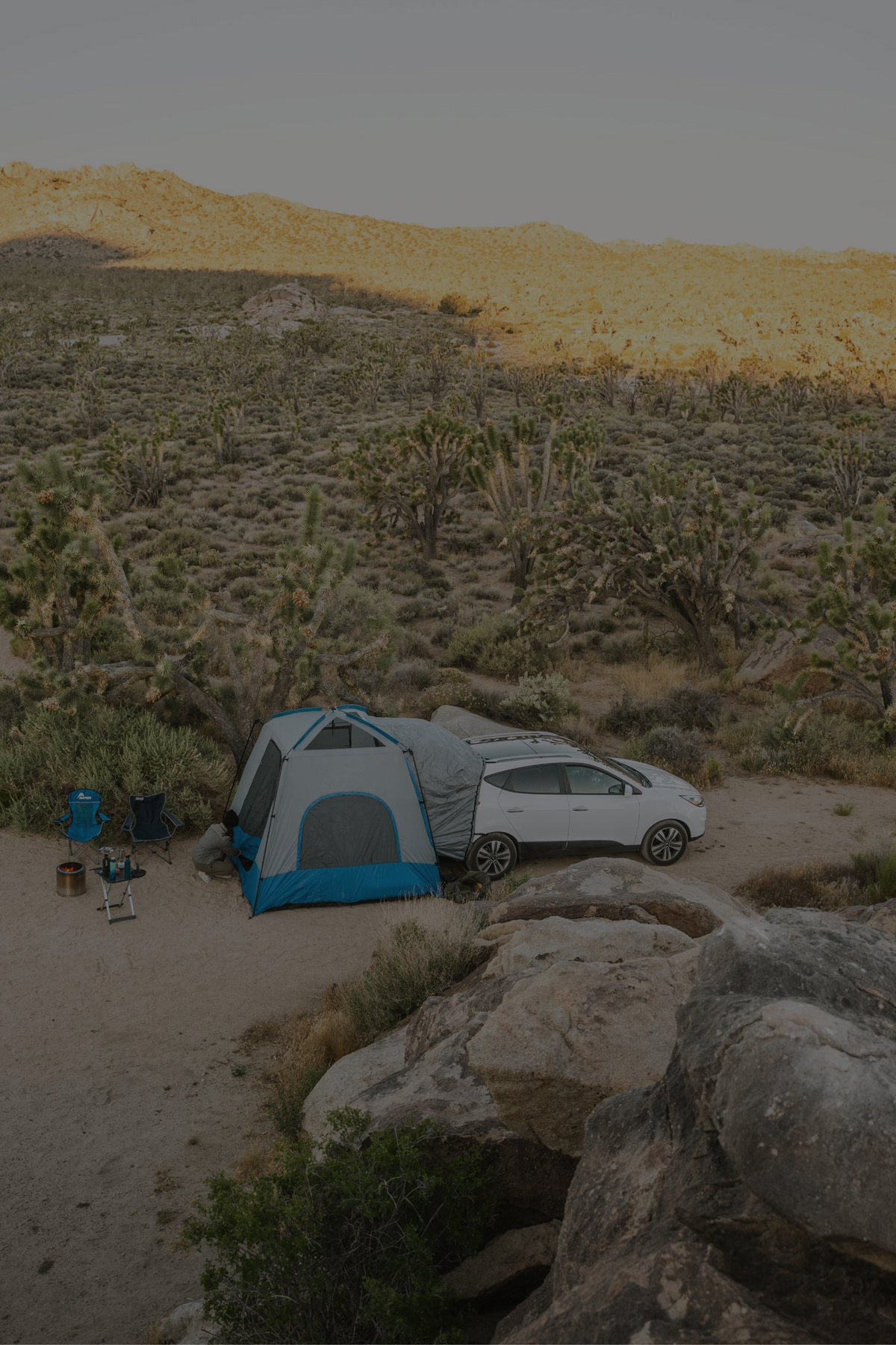 Napier SUV tent on a car in the desert overlanding camping