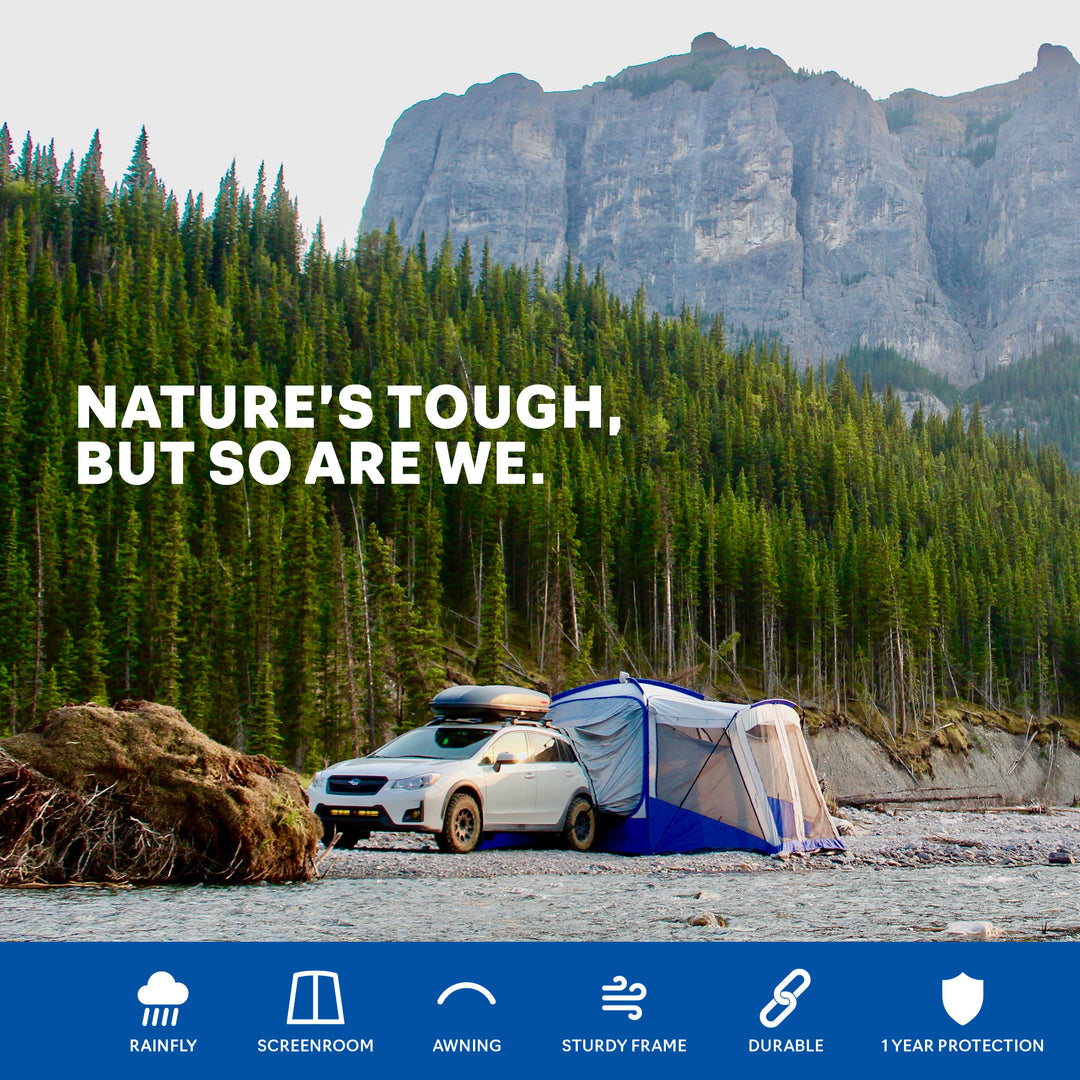 Napier Outdoors Sportz SUV Tent model 84000 blue and grey on a car in the forest, nature's tough, but so are we