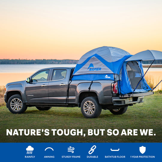 Napier outdoors sportz truck tent blue and grey on a truck at sunset