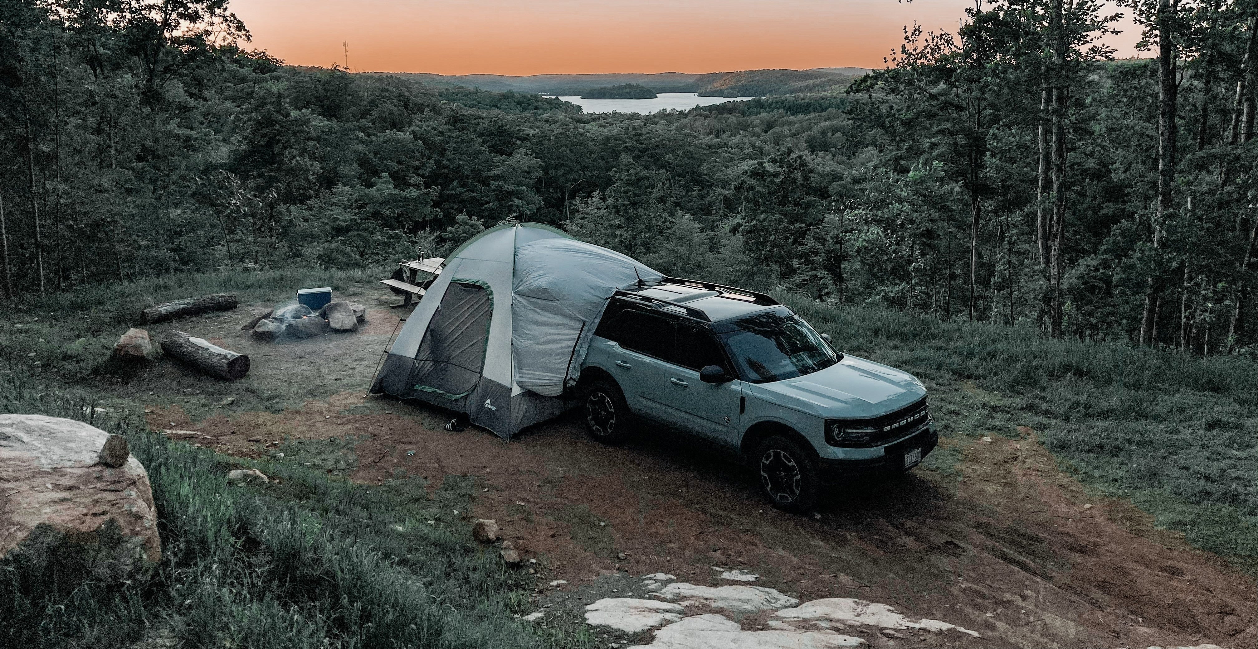 SUV tent camping set up at sunset