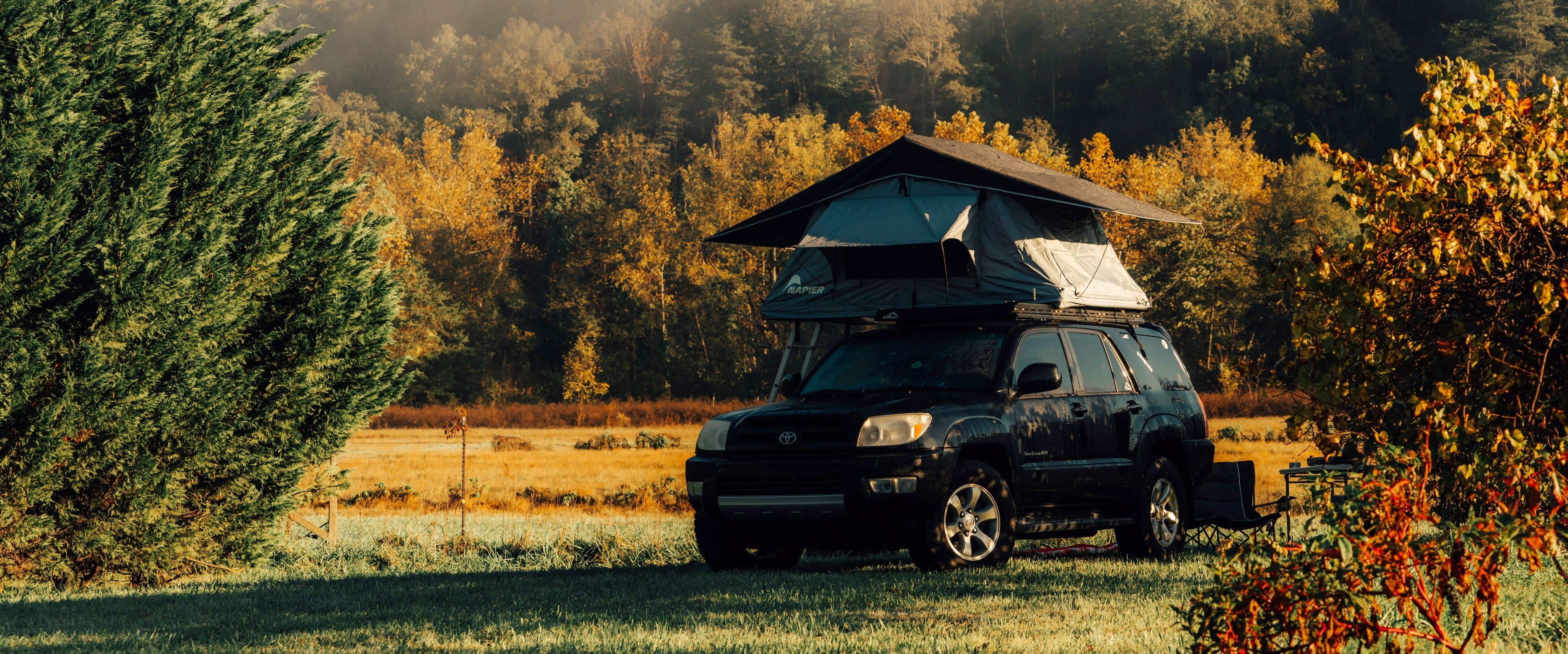 Napier outdoors rooftop tent camping overlanding set up in the forest